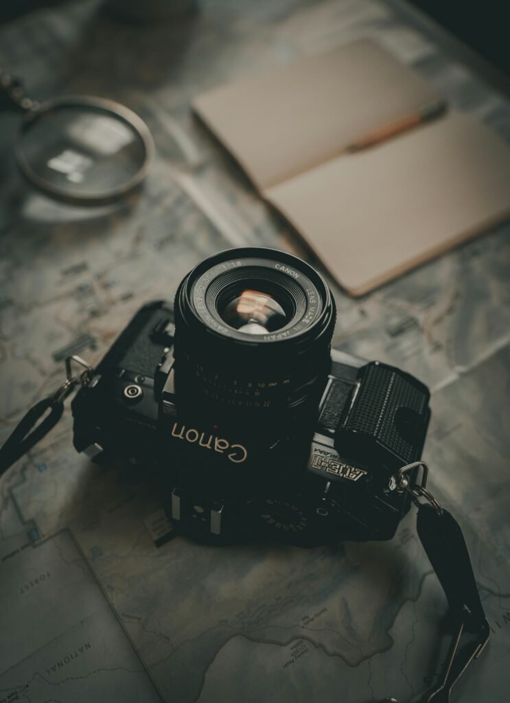 black nikon dslr camera on table