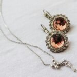 silver and brown gemstone pendant necklace